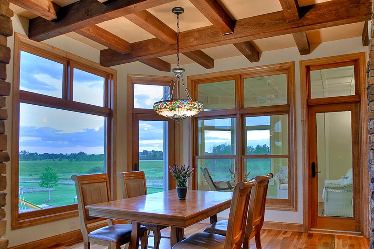 Oak Grove MN dining room remodel featuring a handcrafted coffered ceiling with exposed stained wood beams