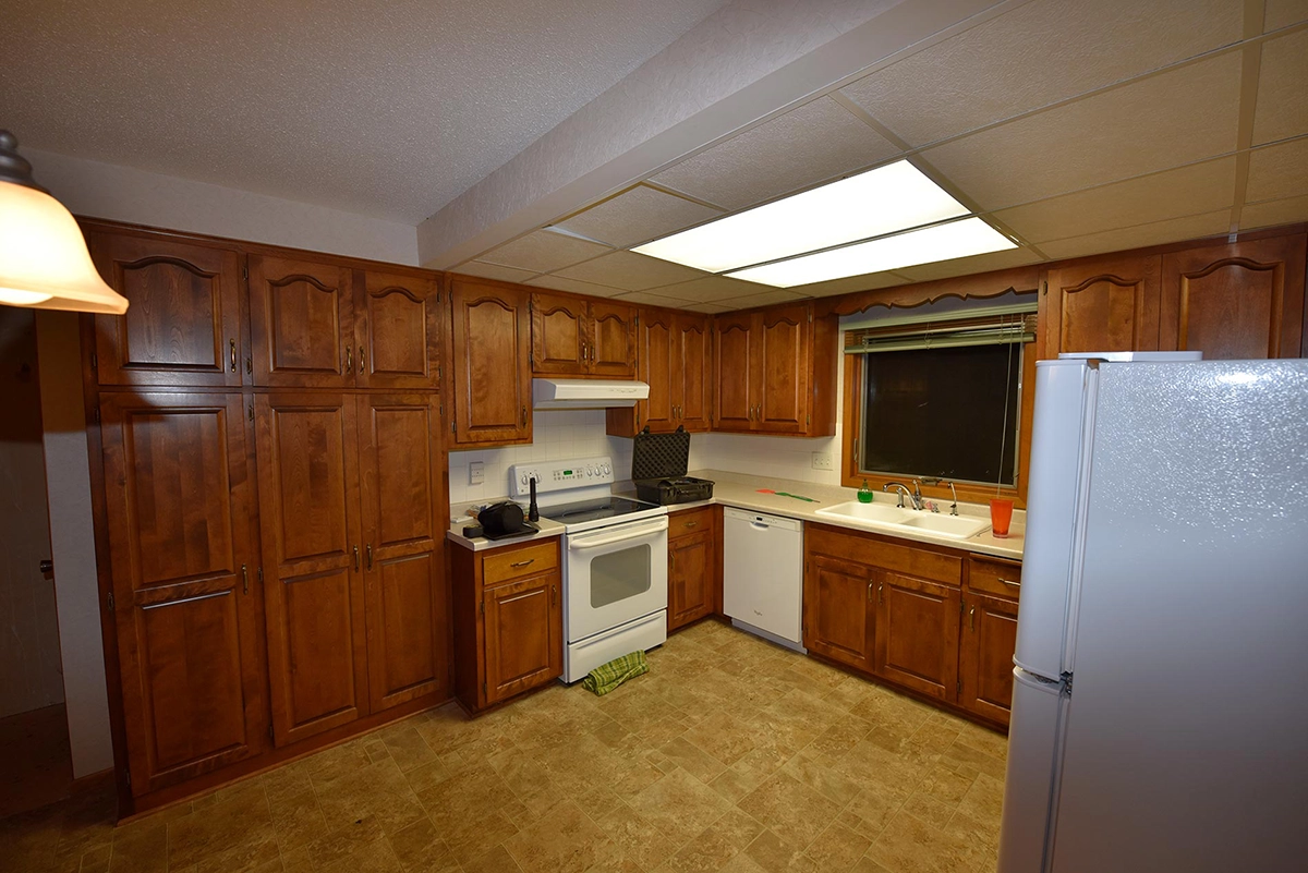 Dated oak kitchen with soffits before demolition in Big Lake MN